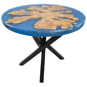 A modern round table with a vibrant blue, swirling epoxy resin surface encasing a uniquely shaped piece of light wood that suggests the branches and trunk of an olive tree.