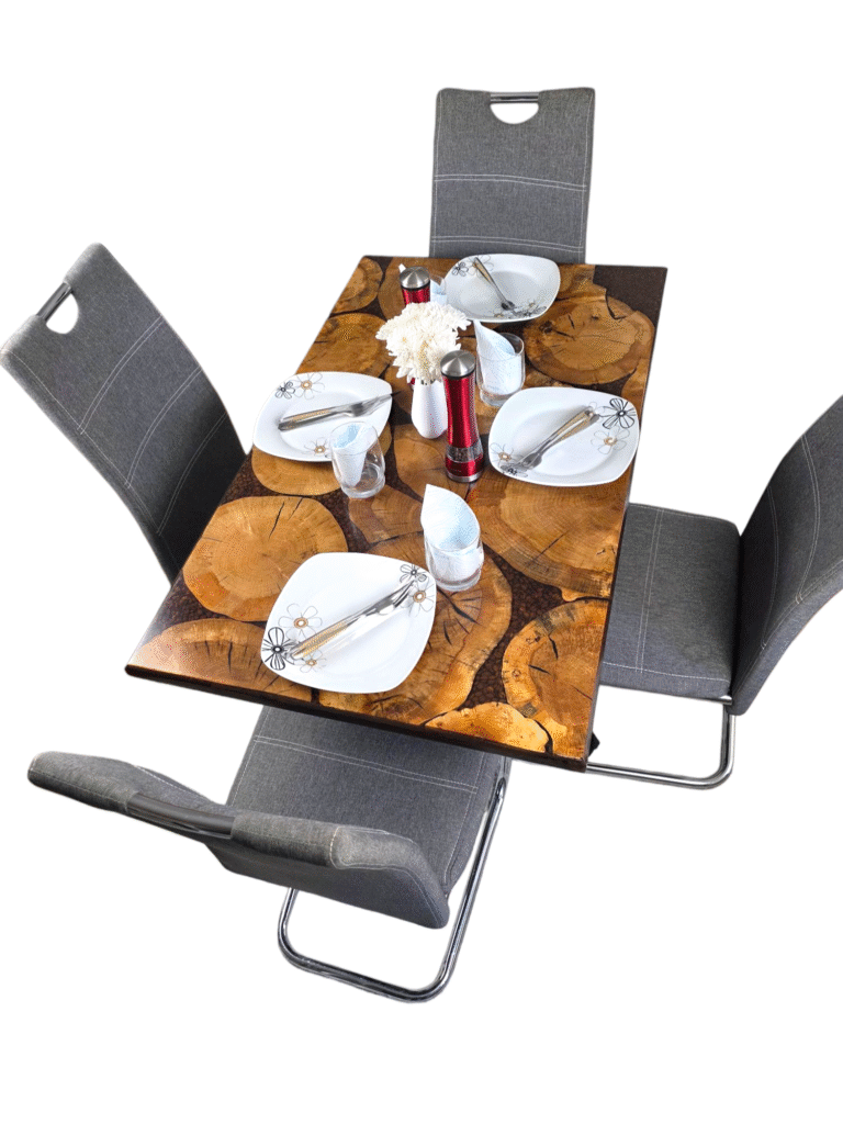 A unique and handcrafted epoxy resin table. The tabletop features a mosaic of irregularly shaped, light brown wood slices embedded within a dark brown, glossy epoxy resin. Some of the wood slices display visible tree rings and natural cracks. The resin is smooth and reflective, catching the light. The table has a dark brown wooden edge and rests on sturdy black legs. The table is a stylish, nature-inspired piece of furniture with a modern touch.