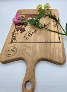 A cutting board with engraved inscriptions