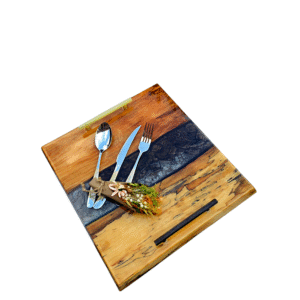Live edge brown and white wood serving platter with a white epoxy resin river.
