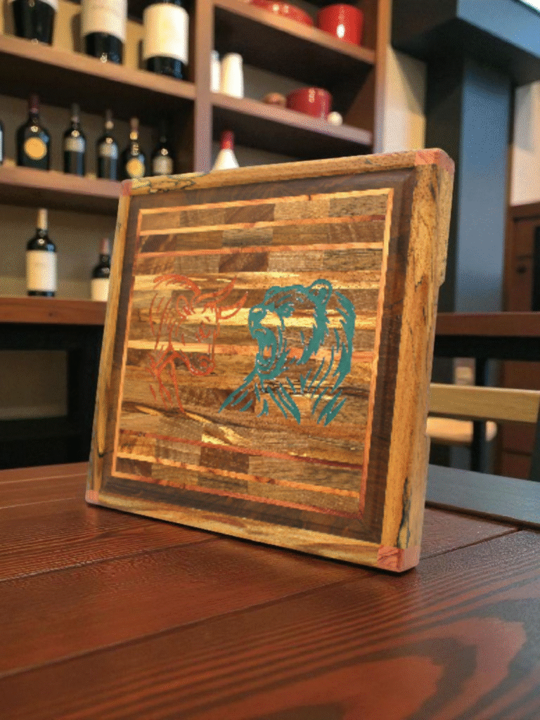 walnut, cherry and maple cutting board with bull and bear head resin inlay