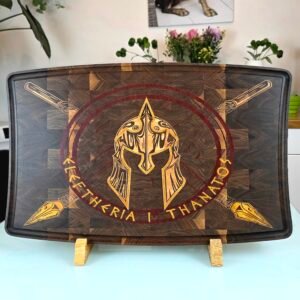 Top-down view of a luxury dark walnut end-grain cutting board featuring an intricate Spartan helmet and crossed spears wood inlay.