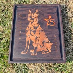 Carved wooden sign featuring a German Shepherd silhouette, with an orange number 5 and star motif on grass.
