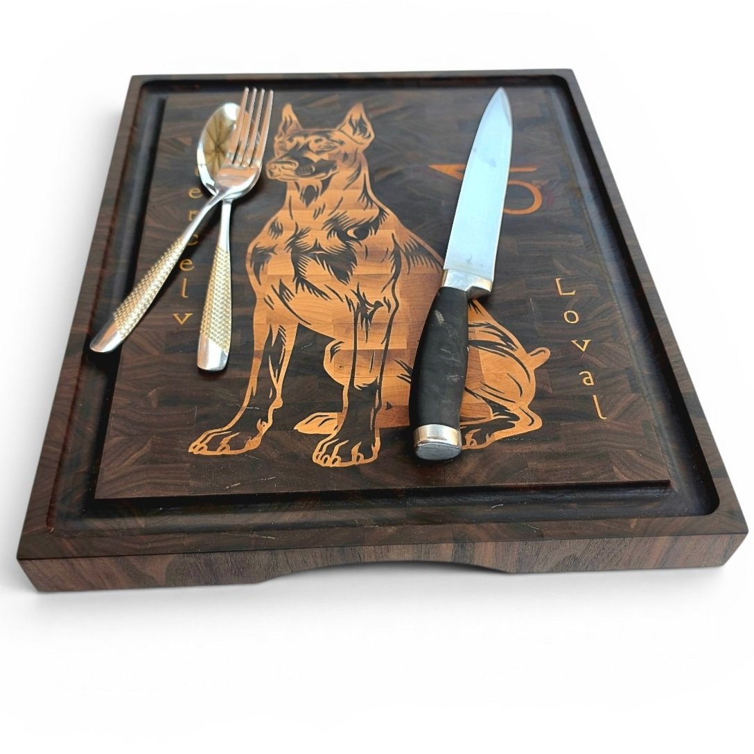 20260708_141804 - M & B CRAFT Handmade walnut end grain cutting board with detailed maple and padauk Doberman dog inlay on a display stand.